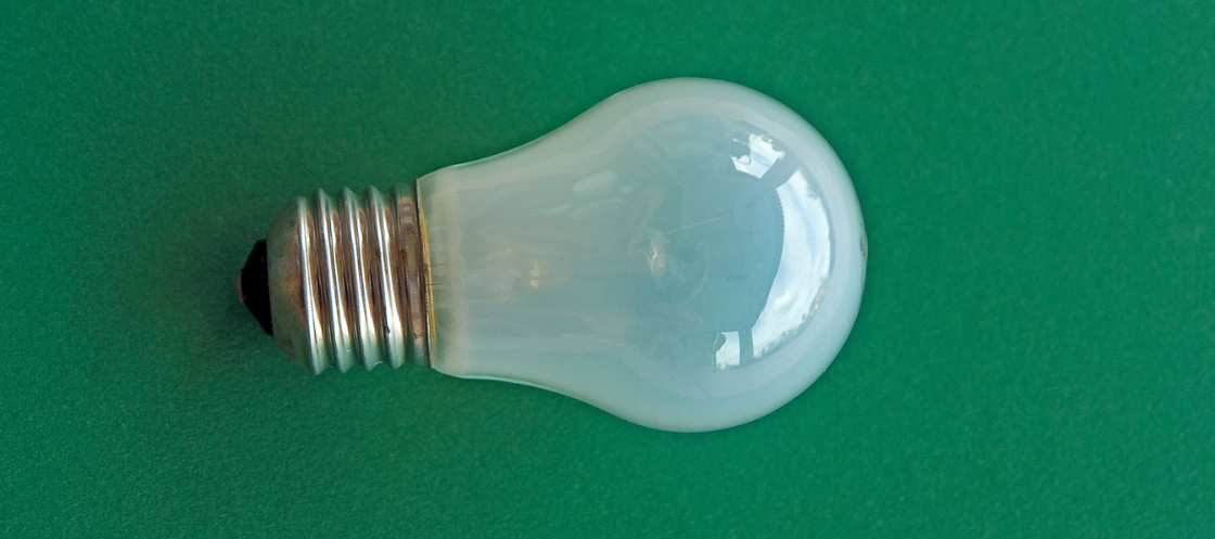 White bulb green background